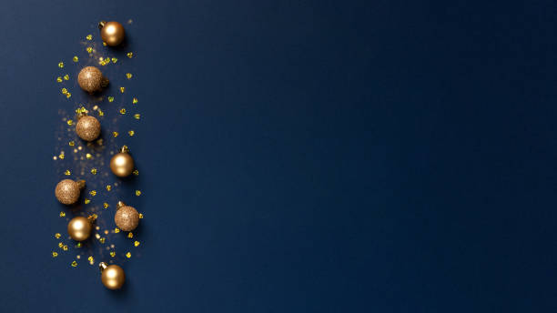 istock Christmas composition with golden balls on blue background banner 1432303014