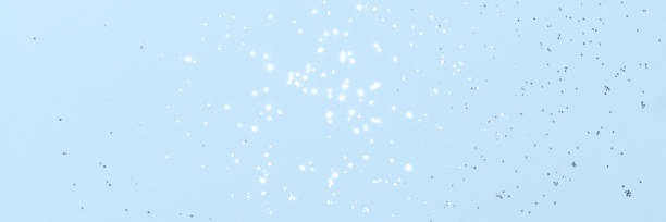 istock Sparkling silver glitter on blue background banner 1432303089