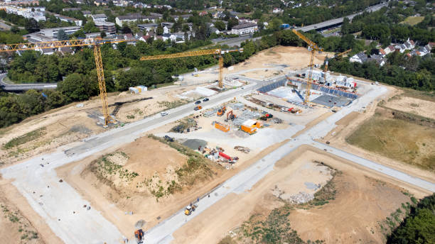 istock Large construction site, cranes and equipment - aerial view 1432304739