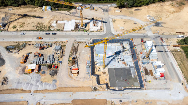 istock Large construction site, cranes and equipment - aerial view 1432304762
