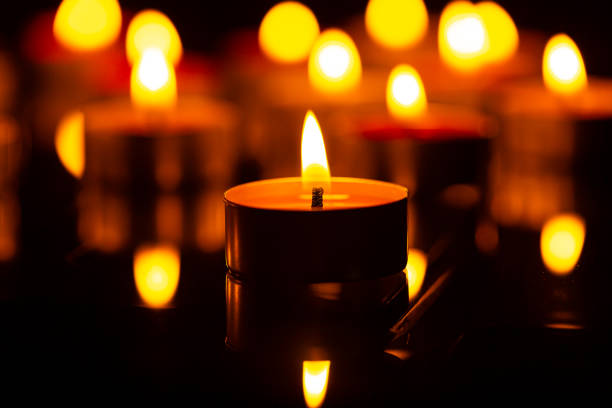 istock macro candle,Candles Burning at Night. White Candles Burning in the Dark 1432306473