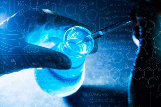 istock Science blue glass tube experiment,Flask in scientist hand with test tubes,Laboratory glassware with a dropper dripping liquid into a test tube. scientific laboratory test tubes, laboratory equipment 1432306519