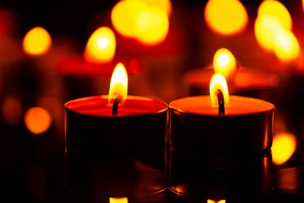 istock macro candle,Candles Burning at Night. White Candles Burning in the Dark 1432307643