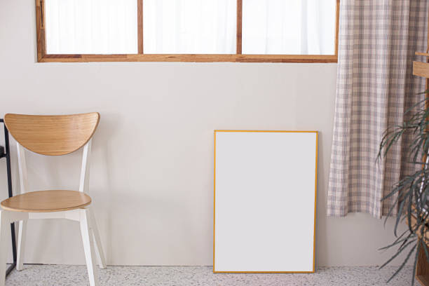 istock Blank photo frame at the wall 1432308883