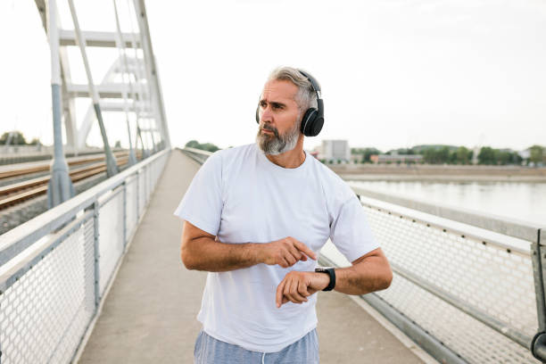 istock Senior Athlete check fitness tracker after training 1432309995