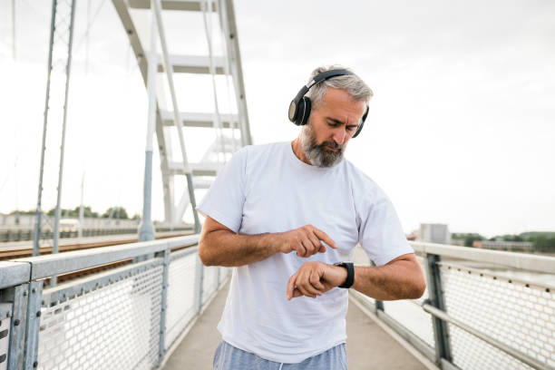 istock Senior Athlete check fitness tracker after training 1432310164