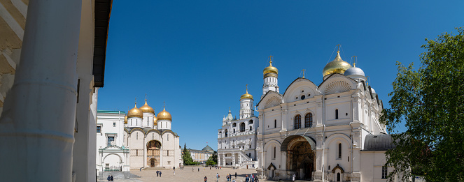 Moscow, Russia - May 22, 2022: The main square of the Moscow Kremlin and view the Archangel Cathedral, the Bell Tower of Ivan the Great, the Assumption Cathedral.