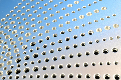 close-up of perforated metal plate