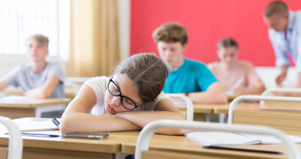 istock Girl sleeping on desk 1432318969