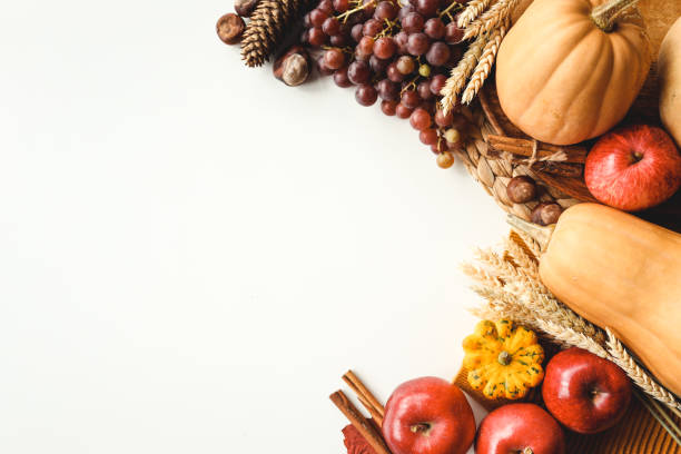 istock Pumpkins and colorful autumn decorations on white background. 1432319392