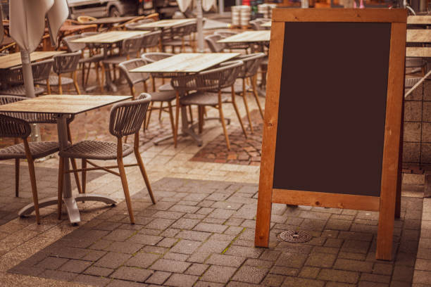 istock Empty sandwich chalkboard stand on a street ready to be filled 1432319497