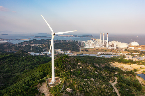 Night scene with wind mills. Wind turbines generating renewable energy. Aerial shot