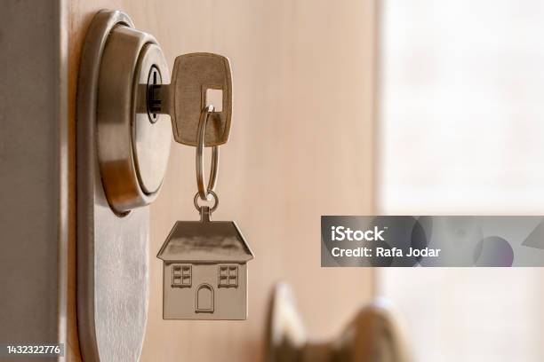 Close Up Of Key And House Keychain In High Security Door Lock Home Insurance Concept Copy Space Stock Photo - Download Image Now