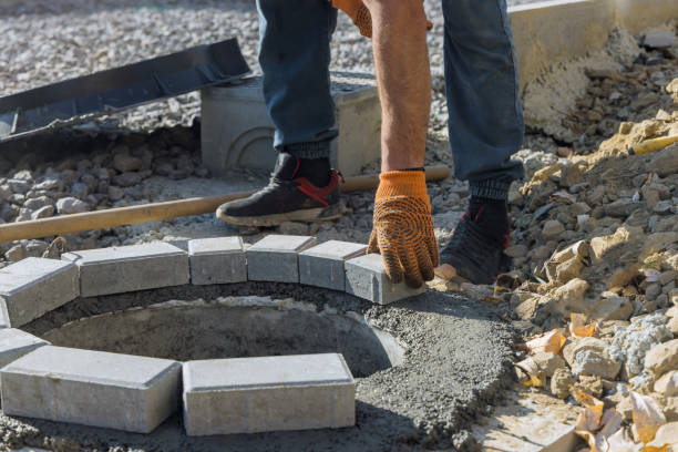 istock Worker constructing a pit for a septic tank sewer manhole reconstruction of sewage pipes in a trench 1432322989