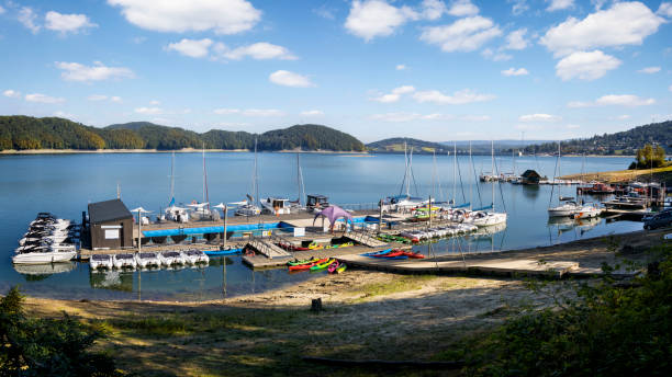 Vacations in Poland - view of marina in  the spa village of Polanczyk on the Lake Solina,  water dam with Bieszczady Mountains in background