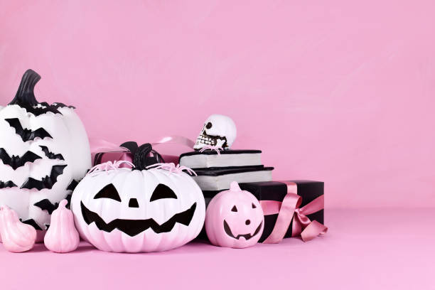 istock Pink Halloween decor with pink and black and white pumpkins 1432328827