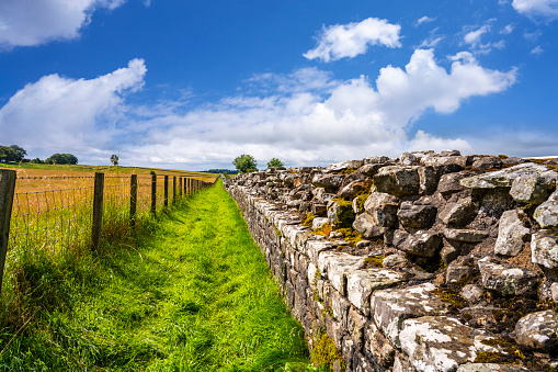 Hadrian's Wall also Roman Wall fortification ruins of old Britannia from AD 122 with the emperor Hadrian and 73 miles long, Unesco World Heritage site