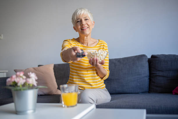 istock Woman watching TV in the room 1432329468