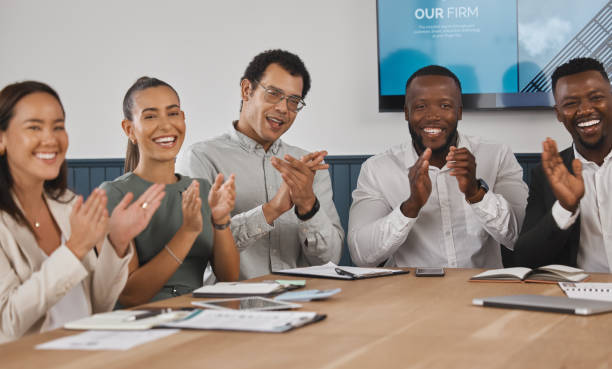 istock A group of young diverse and confident corporate business people clapping while sitting in the boardroom during a work meeting. Celebrating the success and promotion of a coworker. We're happy for you 1432332077