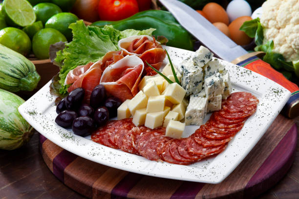 istock cold dish with cheese, Pepperoni, olive and salad on white background isolated 1432335891