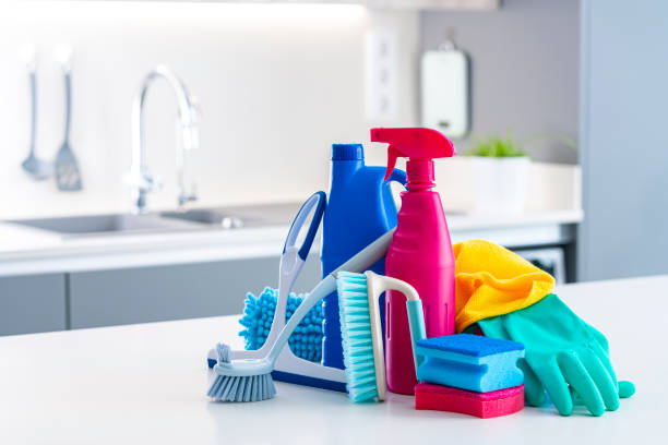 istock Colorful cleaning bottles and tools on kitchen counter 1432336824