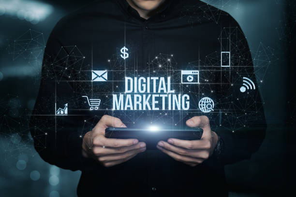 istock Businessman on tablet showing digital marketing. 1432338078