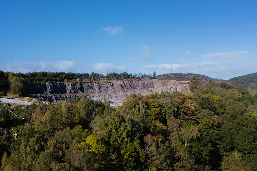 Aerial view from a drone of a granite quarry in a rural location in Scotland on an Autumn morning