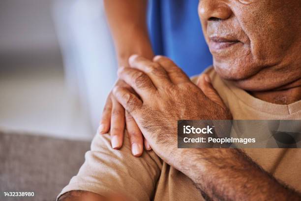 Support Care And Helping Hands For An Elderly Patient During A Consultation At A Nursing Clinic Closeup Of Hope Trust And Comfort From A Woman Caregiver Consulting A Senior Man In Retirement Home Stock Photo - Download Image Now
