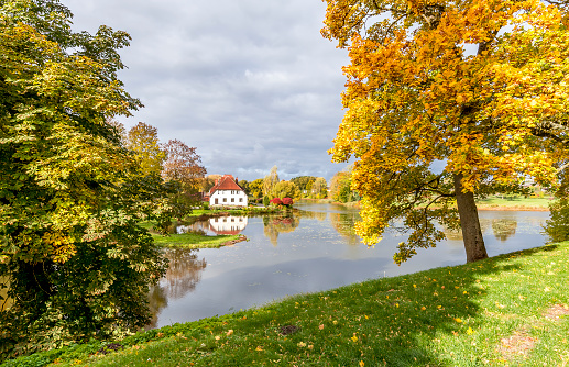 The vibrant colorful autumnal photo was taken in old public European park