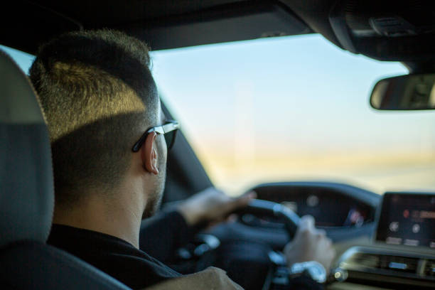 istock Attractive elegant happy man in good car. 1432339197