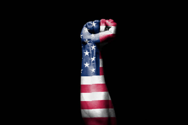 istock Man's hand in a fight signal with the countries flag. 1432339401