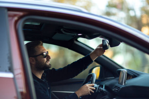 istock Attractive elegant happy man in good car. 1432339515