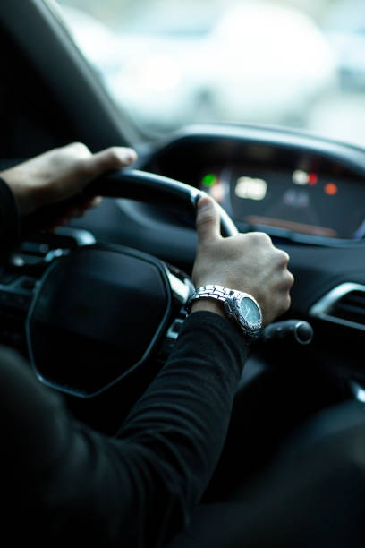 istock Attractive elegant happy man in good car. 1432339583