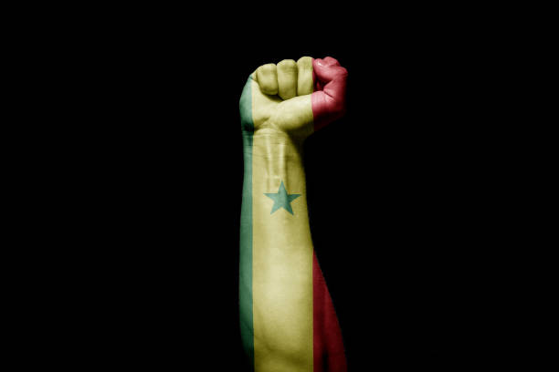 istock Man's hand in a fight signal with the countries flag. 1432339703