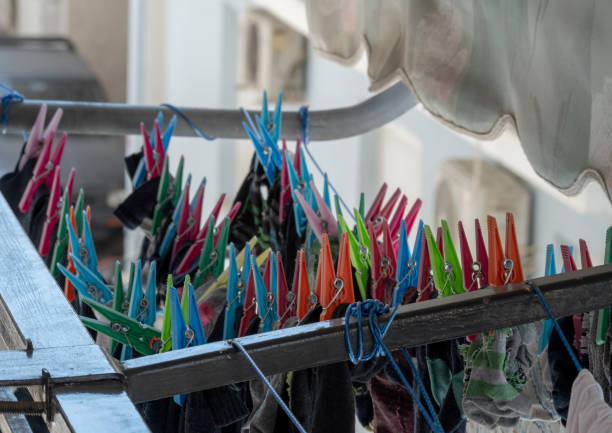 istock Laundry spread on ropes on the balcony with colorful pegs 1432339786