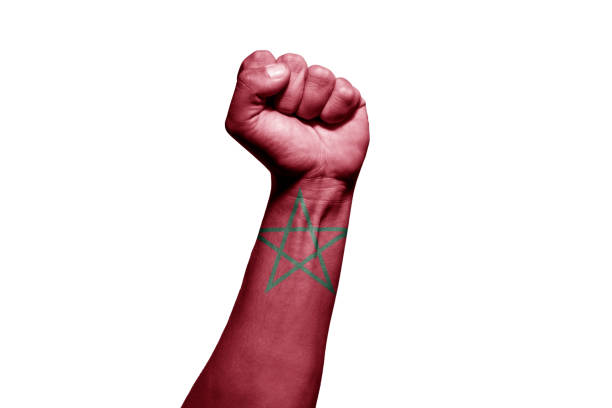 istock Man's hand in a fight signal with the countries flag. 1432339788