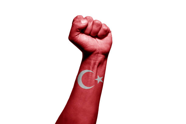 istock Man's hand in a fight signal with the countries flag. 1432339869