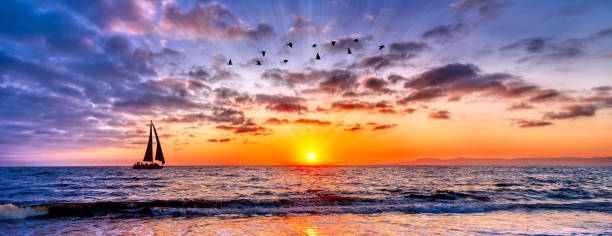 Sunset Ocean Sailboat Beach inspirational Sunrise Vacation Banner stock photo