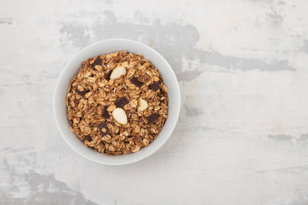 istock muesli with chocolate and nuts in white bowl 1432342196