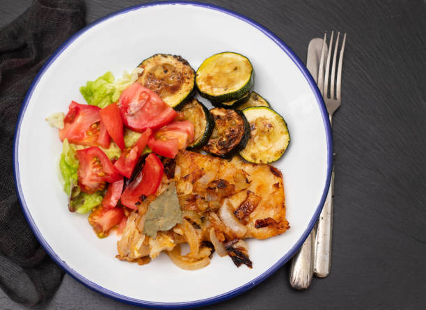istock fried meat with courgette and fresh salad on the plate 1432342330