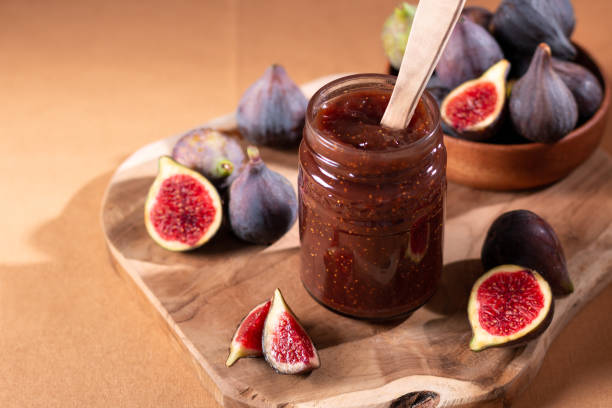 istock Fig jam or fig marmalade on wooden board with fresh, ripe figs 1432342413