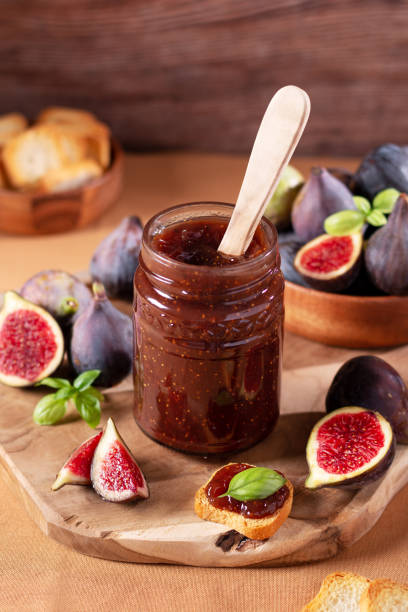 istock Fig jam or fig marmalade on wooden board with fresh, ripe figs 1432342429