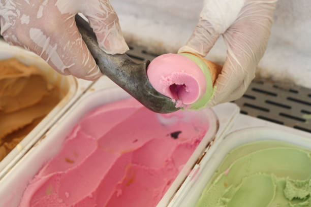 istock Delicious strawberry gelato on a base and held by a spoon. 1432343559