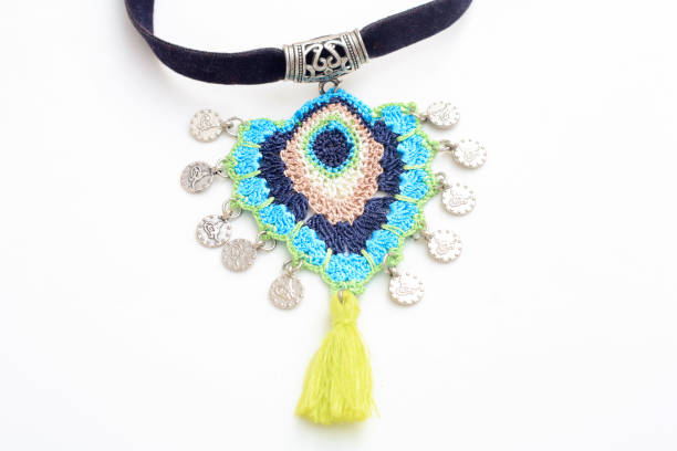 istock Blue handmade necklace with pendant isolated on white background. 1432343773