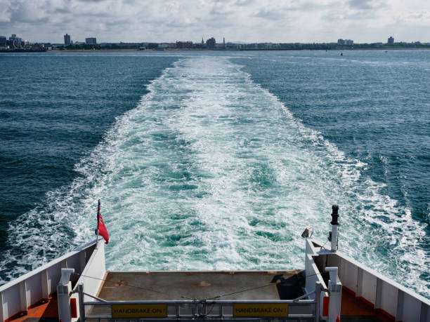 Viewfrom the Isle of Wight ferry towards Portsmouth, Hampshire, England Looking back towards Portsmouth Harbour from the Isle of Wight ferry. parallel port stock pictures, royalty-free photos & images