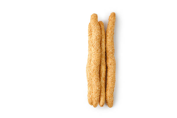 Grissini with sesame seeds isolated on a white background with clipping path. Fresh bread sticks, snack. Cut out. Breadsticks. Top view.