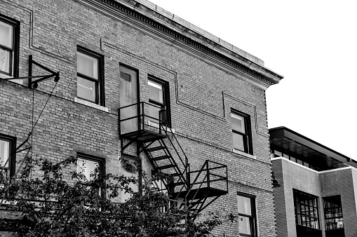Calgary, Alberta - September 25, 2022: A rustic fire escape on a building in Calgary's urban Mission District along 4th Street