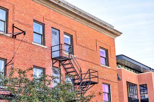 Calgary, Alberta - September 25, 2022: A rustic fire escape on a building in Calgary's urban Mission District along 4th Street