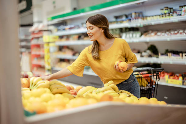istock Young Woman in Supermarket 1432352008