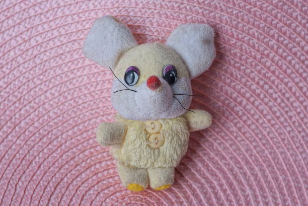 istock one small yellow white cloth toy mouse 1432352347